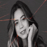 a black and white photo of a woman with red lines around her face