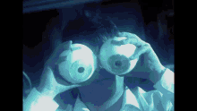 a person is holding a pair of giant eyes in front of their face