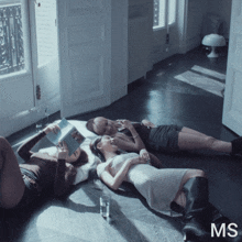 a group of women laying on the floor with the letters ms on the bottom