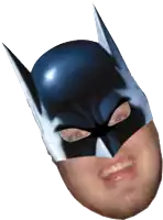 a man is wearing a batman mask with a smile on his face