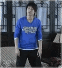 a man wearing a blue shirt that says subclub styles