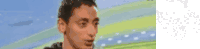 a pixelated image of a man 's face with a blurred background