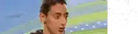 a pixelated image of a man 's face with a blurred background