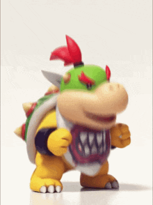 bowser from super mario bros is dancing on a white background