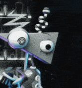 a close up of a robot with a snake on its head and a lightning bolt on its head