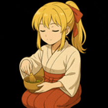 a girl in a kimono is stirring a bowl of green tea with a brush .