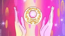 a person is holding a circle in their hands with a purple stone in it .