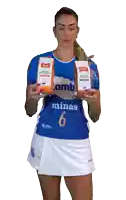 a woman in a blue and white minas 6 jersey holds two bags of coffee