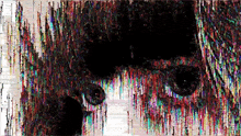 it looks like a painting of a person 's face with a rainbow of colors coming out of it .