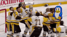 a group of hockey players are celebrating a goal against the bruins