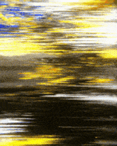 a painting of a sunset with a lot of yellow and blue lines