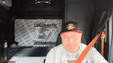 a man wearing a hat and a shirt that says chalga party international