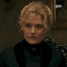 a close up of a woman 's face with the word hbo on the bottom right