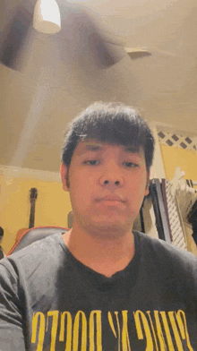 a man wearing a shirt that says nirvana on it