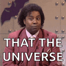 a man in a red suit and tie says that the universe
