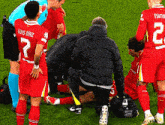 a soccer player named luis diaz is kneeling on the field