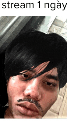 a picture of a man with a mustache and the words stream 1 ngay above him
