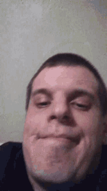 a close up of a man 's face making a funny face