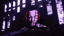 a man 's face is projected on a wall with a ladder in the background