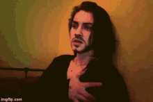 a pixelated image of a man with long hair and a beard with imgflip.com at the bottom of the image