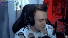 a man wearing headphones and a shirt that says true life