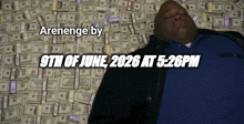 a man laying on a pile of money with the date 9th of june