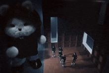 a group of people are dancing in a dark room with a cloud in the background