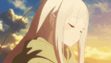 a girl with long white hair and a green hoodie
