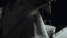 a close up of a person 's torso with a leopard print shirt on