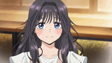 a girl with long purple hair and blue eyes looks at the camera