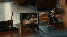 a picture of a man and woman is on a desk