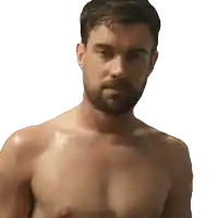 a shirtless man with a beard looks to the side