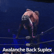 a man is upside down in a wrestling ring with the words avalanche back suplex below him .