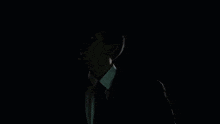 a man in a suit and tie with the words that would be a considerably large nudge above him