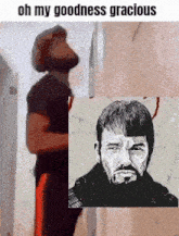 a man with a beard is standing next to a picture of a man .