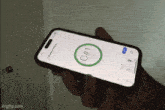 a person is holding a cell phone with a screen that says c # 1 on it