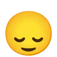 a yellow smiley face with its eyes closed and a light coming out of its head