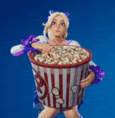 a cheerleader is holding a bucket of popcorn with the letter g on it