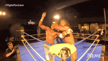two men in a wrestling ring with the words fight for liam on the bottom right