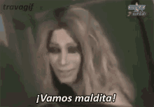 a woman in a wig is saying vamos maldita .