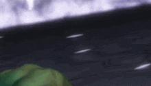 the hulk is laying down on the ground with his eyes closed and his mouth open .
