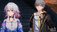 a boy and a girl are standing next to each other in a dark room