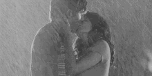 Bajo La Lluvia GIF - Couple Kiss Kissing In The Rain GIFs