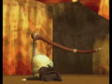 a person is laying on the floor with a hose coming out of their head .