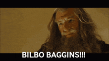 a close up of a man with a beard and the words bilbo baggins