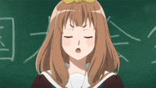 a girl with brown hair is standing in front of a blackboard