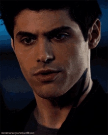 a close up of a man 's face with the website monstersunderyourbed.tumblr.com in the lower right corner