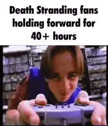 a young boy is holding a video game controller in his hands while playing a video game .