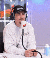a man wearing headphones and a hat that says kill world