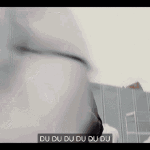 a close up of a person 's face with the words du du du du du underneath it